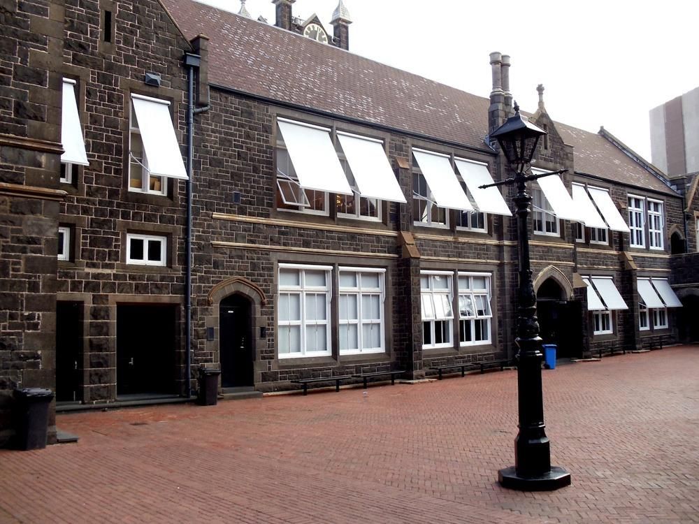 Drop Arm Awnings installed on a school