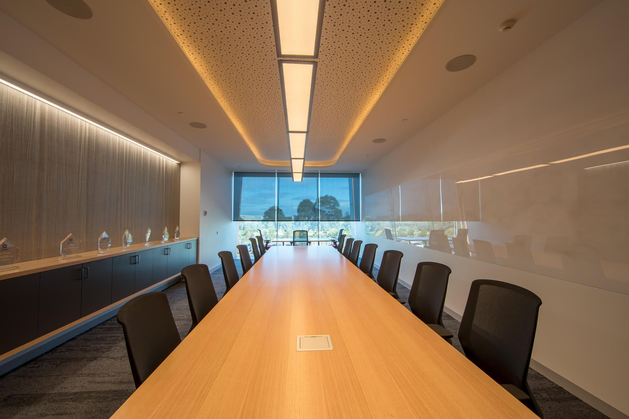 Internal block out blinds blocking out glare in an office space