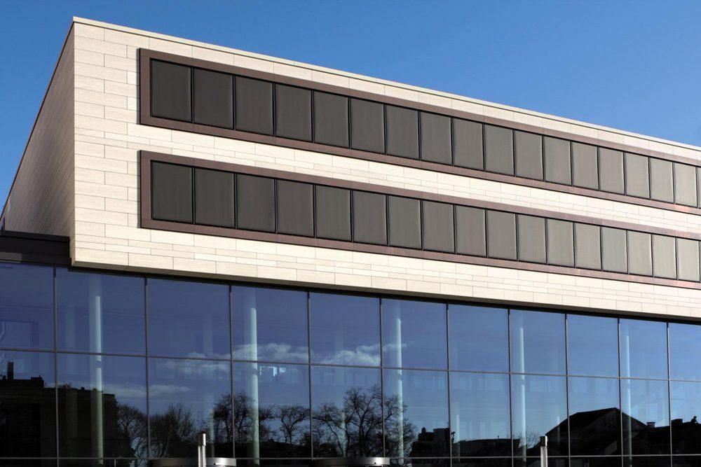 Warema Zip block out blinds drawn down on windows of a commercial building