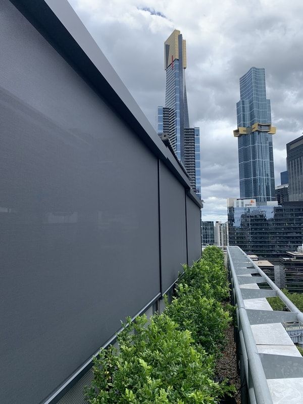 External view of 150mm cassette zip awnings installed at Candela Nuevo