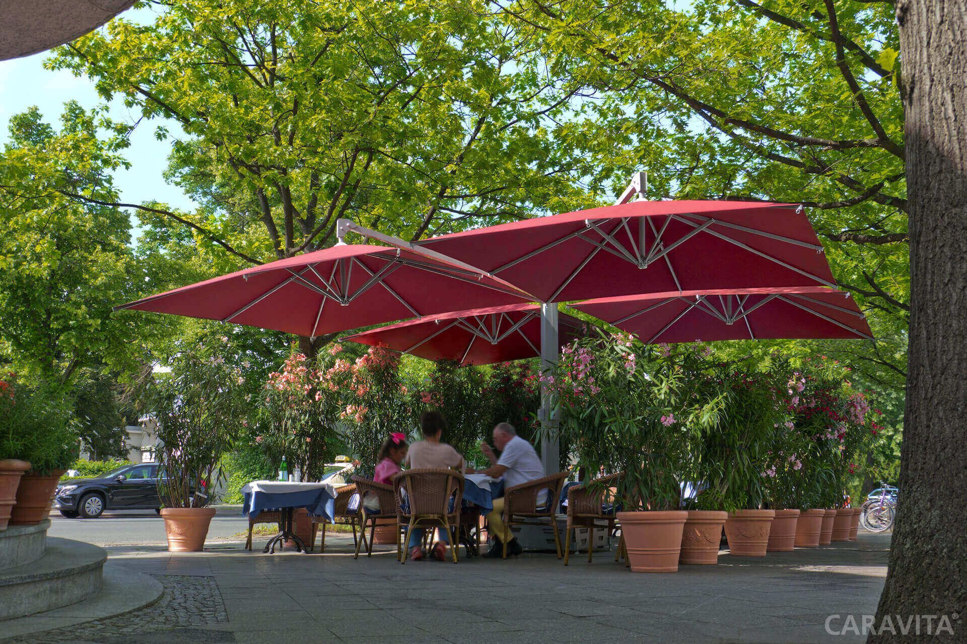 Lifestyle image of an Amalfi Quadro shading a courtyard