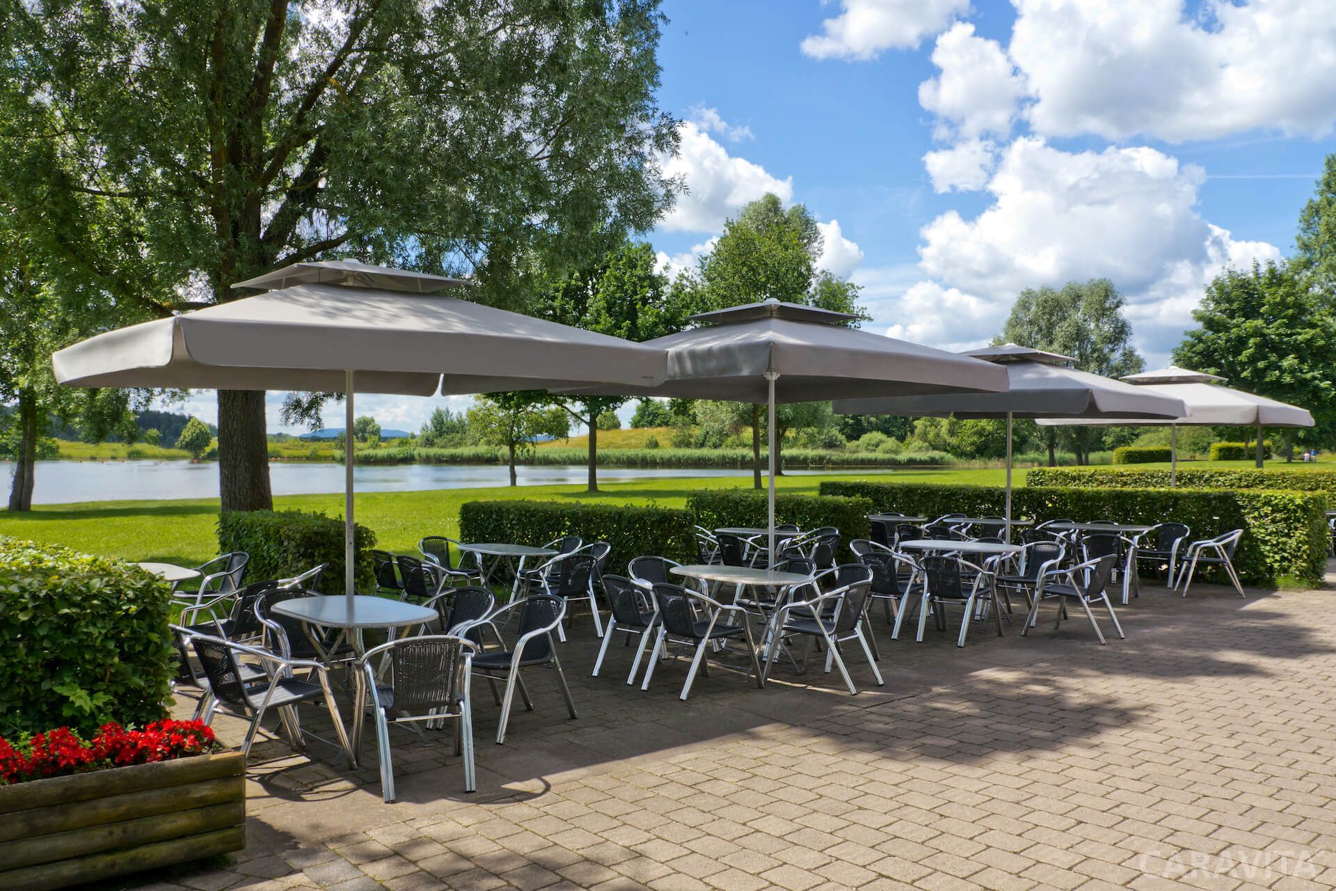 Samara umbrella from Caravita shading an outdoor dining area