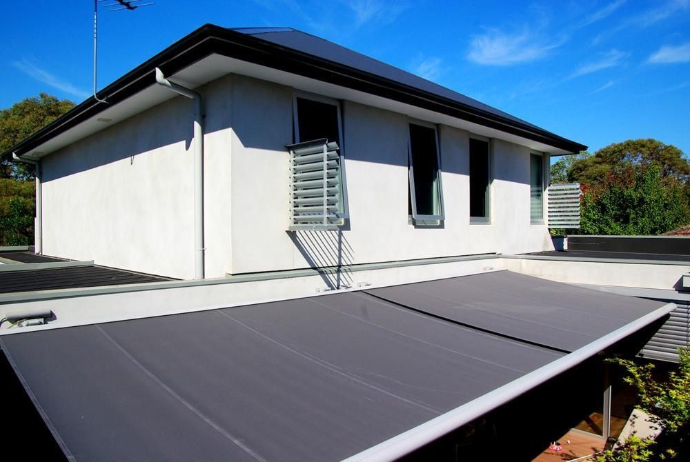 Fixed Louvres installed on sides of windows on a house