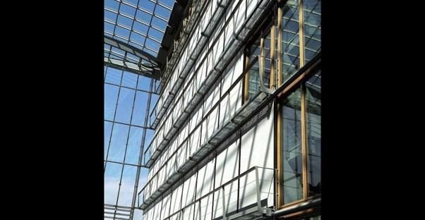 Vertical awning drawn down on the windows of a commercial building