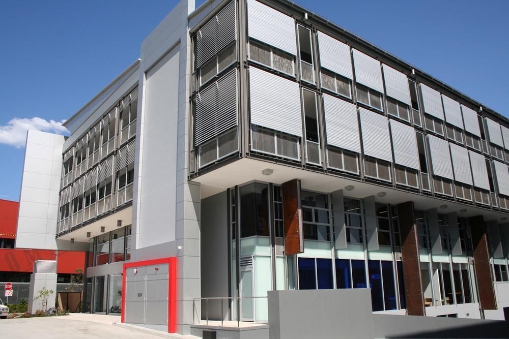 Rack Arm Louvres installed on windows on a commercial building