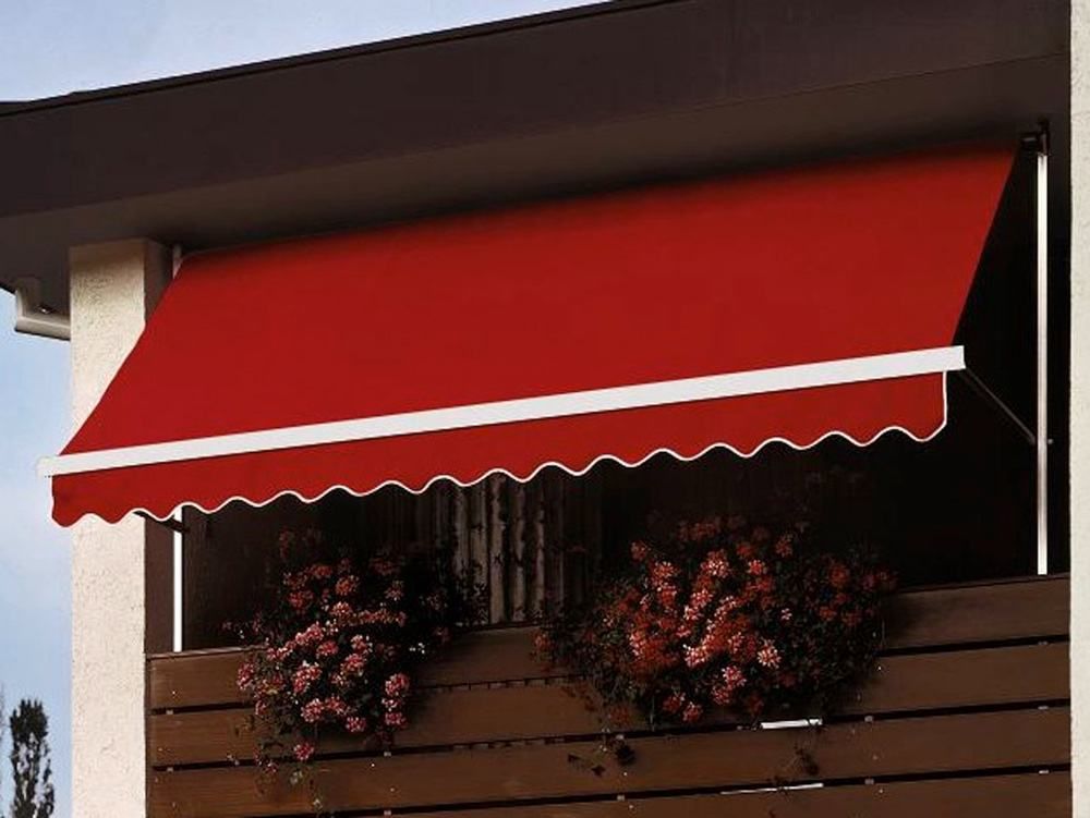 Drop arm awning installed on the side of a residential house