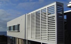 Elliptical louvres on the facade of a residential building