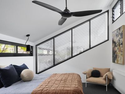 Interior view of some Asymmetric external venetian blinds outside of a bedroom