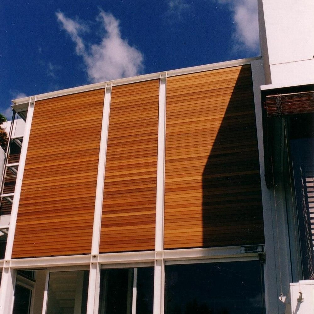 Closed Rack Arm Louvres installed on windows on a residential house